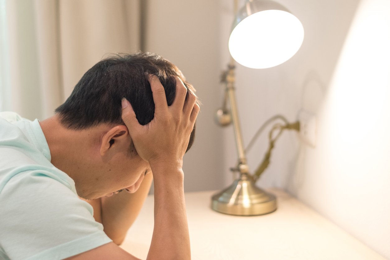 Man holding head in pain